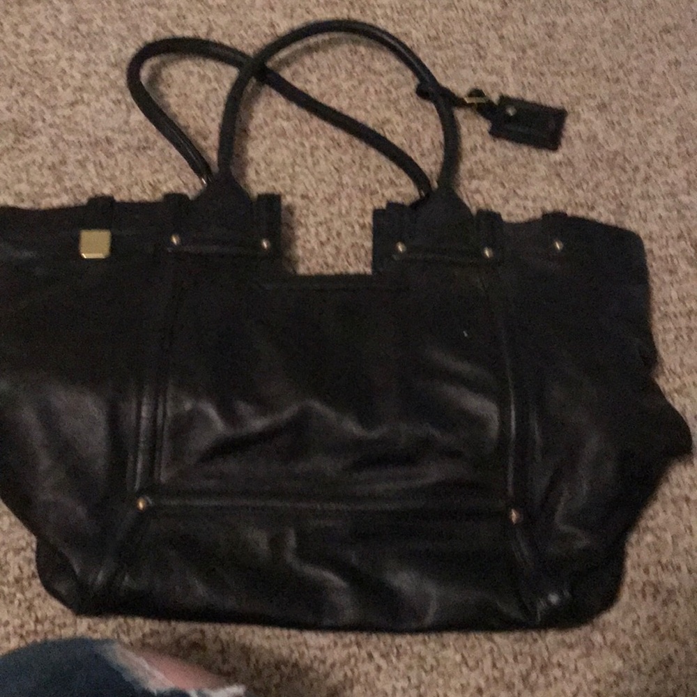 Tumi black leather tote